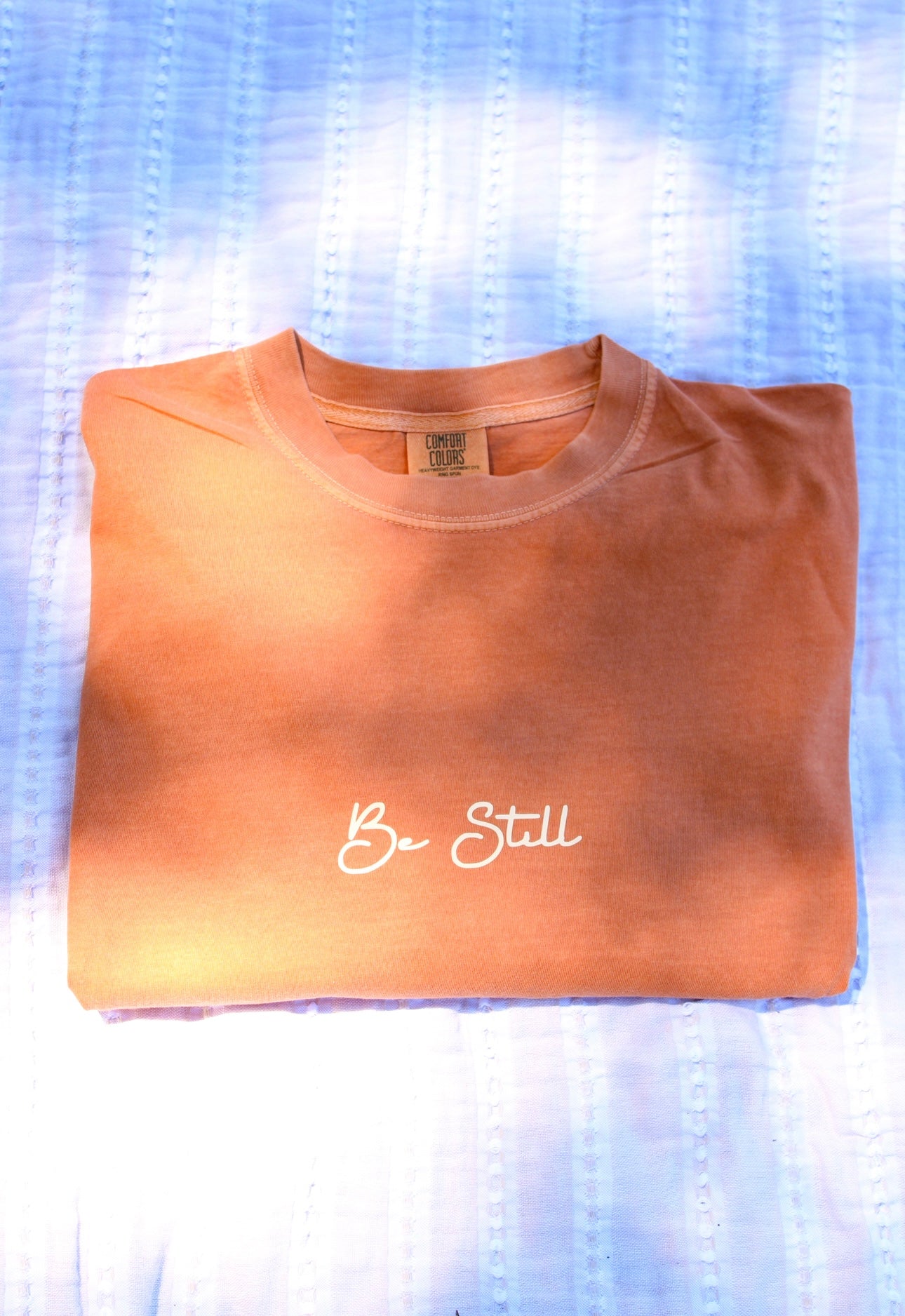 Be Still Tee- limited edition pumpkin color